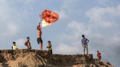A fire-breathing performance in Gaza. Photo by Majd Mahmoud