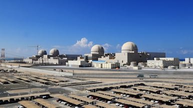 (FILES) A handout picture obtained from the media office of the Barakah Nuclear Power Plant on February 13, 2020 shows a general view of the power plant in the western Al Dhafra Region -formally know as the Gharbiya region- of Abu Dhabi on the Gulf coastline about 50 kilometres west of Ruwais. A fire broke out following a drone strike on a nuclear power plant in the emirate of Abu Dhabi on May 17, 2026, authorities said, reporting no injuries or impact on radiation levels. "Authorities in Abu Dhabi responded to a fire incident that broke out in an electrical generator outside the inner perimeter of the Barakah Nuclear Power Plant in the Al Dhafra Region, caused by a drone strike," the Abu Dhabi Media Office wrote in a social media post. (Photo by Barakah Nuclear Power Plant / AFP) / RESTRICTED TO EDITORIAL USE - MANDATORY CREDIT "AFP PHOTO / Barakah Nuclear Power Plant" - NO MARKETING - NO ADVERTISING CAMPAIGNS - DISTRIBUTED AS A SERVICE TO CLIENTS