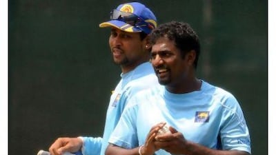 What a career Muralitharan, right, has had. Lakruwan Wanniarachchi / AFP