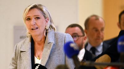 Marine Le Pen, leader of the far-right National Rally, arrives at a court in Paris as trial began on Monday. EPA