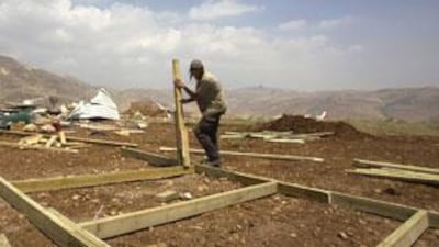 A Jewish settler rebuilds the Maoz Esther outpost near the Jewish settlement of Kokhav Hashahar, northeast of the West Bank city of Ramallah.