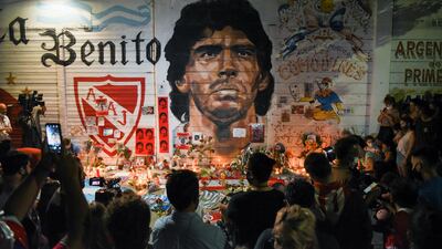 People gather to mourn the death of soccer legend Maradona, outside the Diego Armando Maradona stadium, in Buenos Aires. Reuters