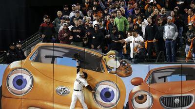 San Francisco Giants left fielder Gregor Blanco, centre, of Venezuela is unable to reach for a two-run home run ball hit by Chicago Cubs Kris Bryant, not pictured, during the ninth inning of the MLB National League Division Series playoff game three between the Chicago Cubs and the San Francisco Giants at AT&T Park in San Francisco, California. EPA