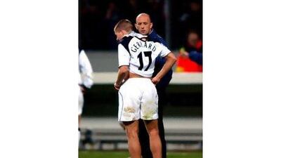 Steven Gerrard credits Gary McAllister, background, with helping him mature during the Scot's two-year stint at Liverpool. John Walton / EMPICS