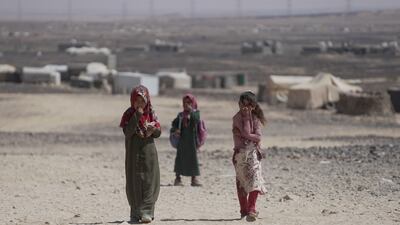 Girls return from school at a camp for internally displaced people in Marib, Yemen. Reuters