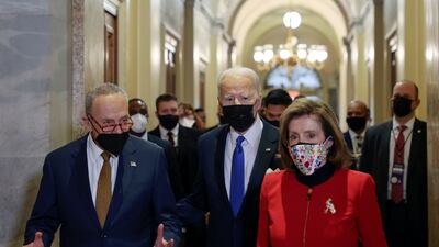 US President Joe Biden with Ms Pelosi and Senate Majority Leader Chuck Schumer in the US Capitol on January 6, 2022. AP