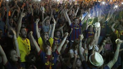 Barcelona supporters celebrate their team's victory in the Uefa Champions League final. (AP Photo/Manu Fernandez)