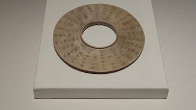 'Jade Bi', painted wood, about 1200 BCE, with 1790 CE inscription, China. Mona Al-Marzooqi / The National