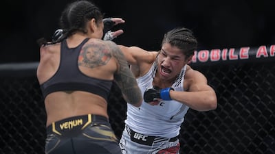 Julianna Pena moves in with a hit against Amanda Nunes. Reuters