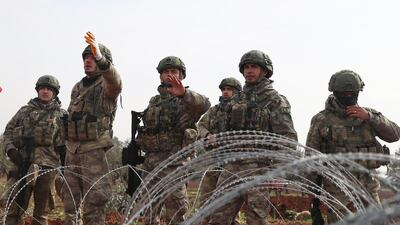 Turkish soldiers at an observation post in the town of Binnish, Idlib. AFP
