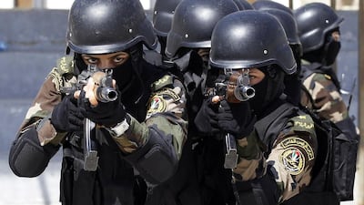 Female members of the Palestinian presidential guard take part in a training session in the West Bank city of Jericho April 6, 2014. Ammar Awad / Reuters