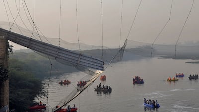 Rescuers search for survivors after a suspension bridge in Morbi town, in the western Indian state of Gujarat, collapsed. Reuters