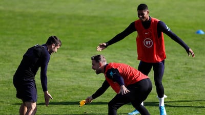 Left to right: England's Harry Winks, Jordan Henderson and Marcus Rashford. Reuters