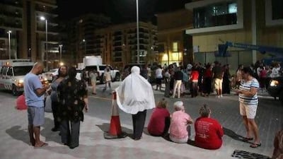 Residents of the Al Rayyana residential development are evacuated from their homes.