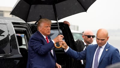 Walt Nauta, right, and former president Donald Trump at Ronald Reagan Washington National Airport in Virginia. AP