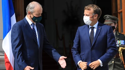 Irish Prime Minister Micheal Martin, left, greets French president Emmanuel Macron in Dublin. AP