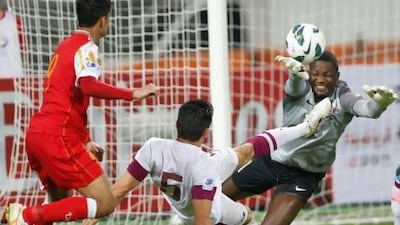 Goalkeeper Qassem Burhan, right, won most of his fights against Abdulaziz Mubarak, left, and the rest of the Oman team.