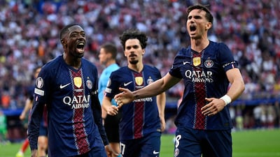 PSG players celebrate after Ousmane Dembele, left, scored from the spot. AFP