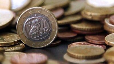A Greek euro coin sits on a stack of euro coins arranged for a photograph in Athens, Greece, on Friday, April 9, 2010. Greece may need to seek emergency aid from the International Monetary Fund within days as a surge in financing costs makes funding its budget deficit unsustainable, UBS AG economists said. Photographer: Kostas Tsironis/Bloomberg *** Local Caption *** 657891.jpg