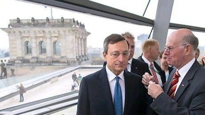 The banker and the politician: Mario Draghi, left, the president of the ECB and Norbert Lammert, the president of the Bundestag. Thomas Peter / Reuters