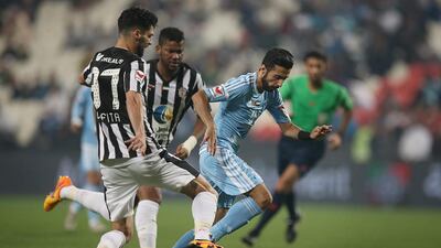 Al Jazira, in white and black, continue their march up the Arabian Gulf League table with a 3-2 win over Baniyas. Adel Al Noaimi / Al Ittihad
