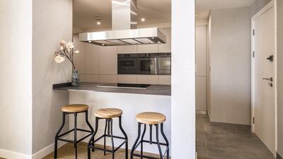 A breakfast bar is a convenient addition. Courtesy LuxuryProperty.com