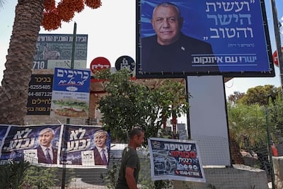 Posters and banners featuring Israeli Prime Minister Benjamin Netanyahu, left, and election rival Gadi Eisenkot, in Ramallah. AFP