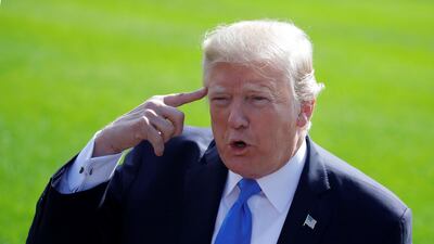 US president Donald Trump talks with reporters as he departs the Oval Office for Dallas on October 25, 2017. Carlos Barria / Reuters