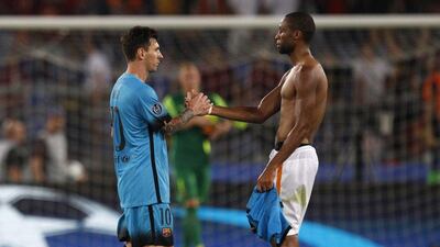 Barcelona's Lionel Messi, left, greets AS Roma's Seydou Keita after their 1-1 draw in the Champions League on Wednesday night at the Stadio Olimpico in Rome. Riccardo De Luca / AP