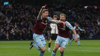 Collins celebrates scoring their first goal with Charlie Taylor. Action Images