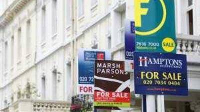 Estate agents' sale signs in London.