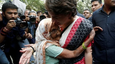 Priyanka Gandhi Vadra, leader of India's main opposition Congress party and sister of party's president Rahul Gandhi, is hugged by an elderly woman at a polling station in New Delhi, India. Reuters