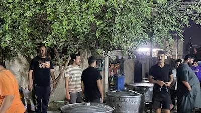 This is the fourth consecutive year that neighbours have come together to fund the community cooking ritual. Sinan Mahmoud / The National