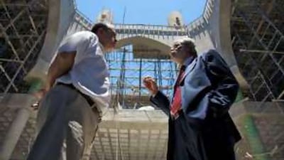 Issam Fa'roun, the mayor of Izzariya, left, and Jamal Baghdadi, the architect who designed the mosque, are working to see the project through to completion.