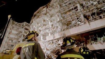 Firemen at the base of the nine-storey Alfred P Murrah Federal Building in Oklahoma City after the April 1995 bombing. AFP