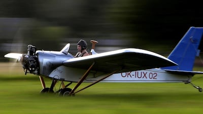 Mr Hadrava takes off near the village of Zdikov, Czech Republic, on his way to work. David W Cerny / Reuters