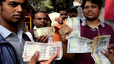 Indians line up outside the Reserve Bank of India to deposit the old rupee notes. The Modi government in November scrapped 500 and 1,000 rupee notes in an effort to crack down on black money. Jagadeesh JV / EPA