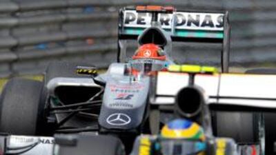 Mercedes GP driver Michael Schumacher, back, during qualifying yesterday.