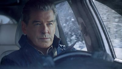 Pierce Brosnan gets behind the wheel for Kia. Kia / AP Photo