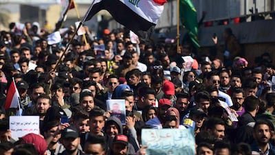 epa08192143 Iraqi university students carry placards during a strike and protests in central Baghdad, Iraq, 04 February 2020. Thousands of Iraqi students continue their protests in Baghdad and southern Iraqi cities against the appointment of Mohammed Tawfiq Allawi as prime minister-designate. EPA/MURTAJA LATEEF