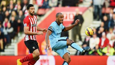 Vincent Kompany of Manchester City clears the ball from Graziano Pelle of Southampton during their Premier League match on Sunday. Shaun Botterill / Getty Images / November 30, 2014