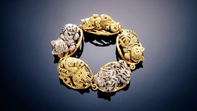 A baby tiger bracelet-brooch jewel for the Japanese royal family is rendered in18K gold with multicoloured pavé diamonds by gemstone artist Andreas von Zadora-Gerlof