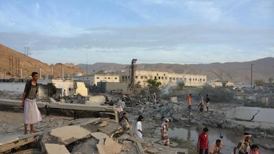 People inspect damage from Saudi-led air strikes on Mukalla port in southern Yemen on April 24, 2016. Reuters
