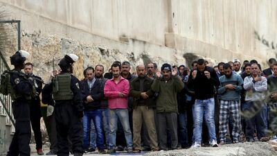 Israeli border police stand guard during Friday prayer outside a mosque in the West Bank city of Hebron on November 6, 2015. Elsewhere in the city, Israeli police shot dead a 73-year-old woman. Mussa Qawasma/Reuters