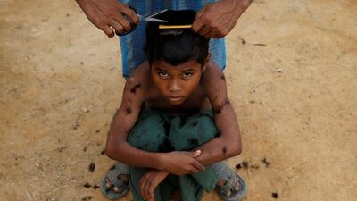 A Rohingya refugee boy gets a haircut at the Kutupalong refugee camp near Cox's Bazar, Bangladesh. Navesh Chitrakar / Reuters