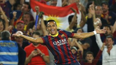 Alexis Sanchez celebrates after scoring the winning goal in Barcelona's 2-1 defeat of Real Madrid at the Camp Nou. Emilio Morenatti / AP Photo