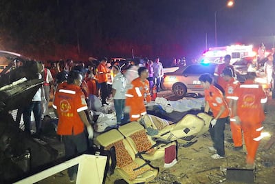 Rescue workers search for victims of a bus accident in Thailand's Nakhon Ratchasima province on March 22, 2017. AFP