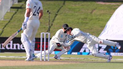 New Zealand wicketkeeper BJ Watling, right, dives ahead of teammate Ross Taylor to take a catch and dismiss England's Joe Denly. AFP