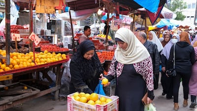 Shoppers at fruit market in Alexandria, Egypt, where inflation is nearing 20 per cent. Bloomberg