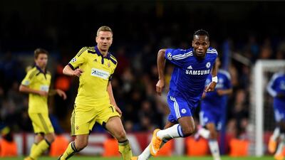 Ales Mejac, left, of Maribor and Didier Drogba of Chelsea compete for the ball during their Uefa Champions League Group G match at Stamford Bridge on October 21, 2014, in London. Shaun Botterill / Getty Images